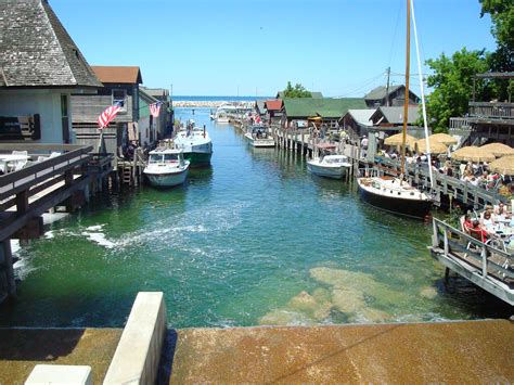 Fishtown leland - Fishtown is a collection of weathered fishing shanties, smokehouses, overhanging docks, fish tugs and charter boats along the Leland River in Leland, Michigan.